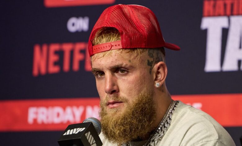 jake paul next to mike perry before their boxing match