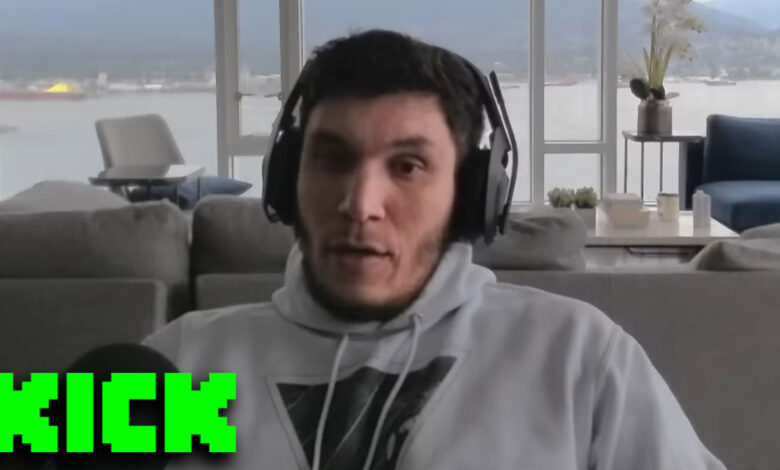 Trainwrecks sat at desk with Kick logo