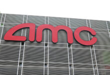 LAS VEGAS, NEVADA - AUGUST 20:  People enter AMC Town Square 18 on August 20, 2020 in Las Vegas, Nevada. AMC Theatres reopened more than 100 of its movie theaters across the United States today, with new safety precautions in place, for the first time since closing in March because of the coronavirus (COVID-19) pandemic. In celebration of its 100th anniversary, the world's largest theater chain is welcoming guests back with a "Movies in 2020 at 1920 Prices" promotion for one day by offering 15-cent tickets to classic and previously-released films and USD 5 concession items. Starting on August 21, older movies will be shown for USD 5 a ticket. According to AMC, enhanced cleaning and safety protocols include disinfecting theaters before each show, mandatory face coverings for employees and customers, upgraded air filtration systems where possible, and high-touch points cleaned throughout the day. Hand sanitizer and disinfectant wipes are available throughout the theaters, auditoriums are at 40 percent capacity or less, and concession menus have been simplified for shorter lines and quicker service.  (Photo by Ethan Miller/Getty Images)