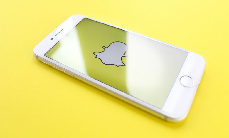 Snapchat logo on yellow background